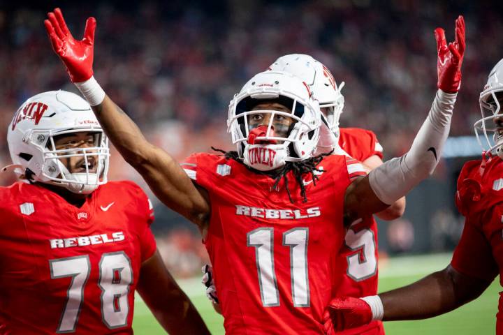 UNLV wide receiver Ricky White III (11) celebrates after scoring a touchdown during the college ...