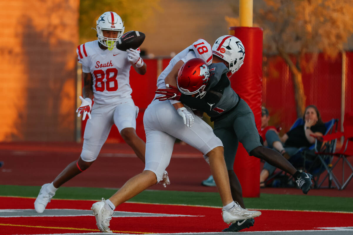 Arbor View cornerback Teddy Johnson (1), right, tackles Millard South wide receiver Isaac Jense ...