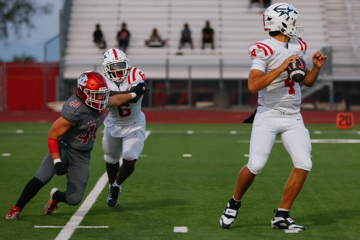 Millard South running back Nelson Wheeler (6) keeps Arbor View’s Glade Hales (40) away f ...
