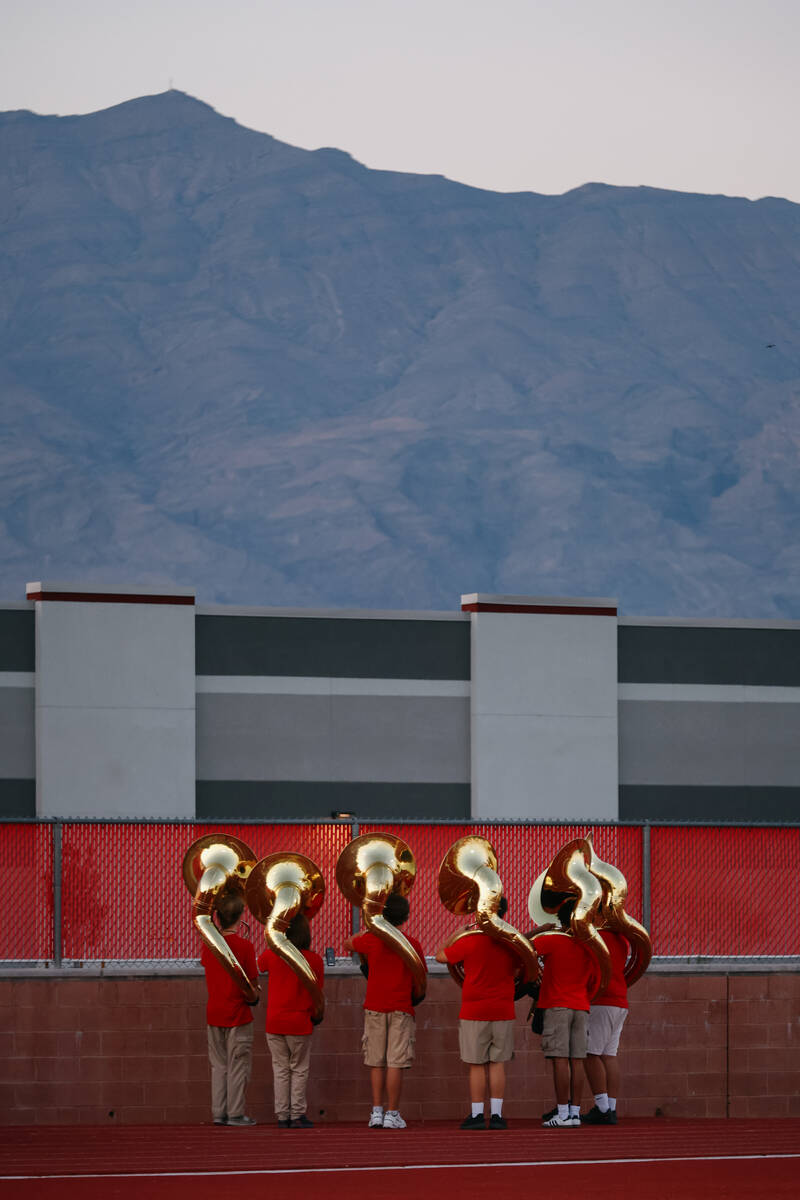 Members of the Arbor View marching band practice before halftime starts during the football gam ...