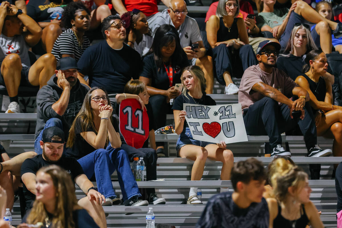 Arbor View fans sit with signs in the stands during a football game on Friday, Aug. 29, 2025 at ...
