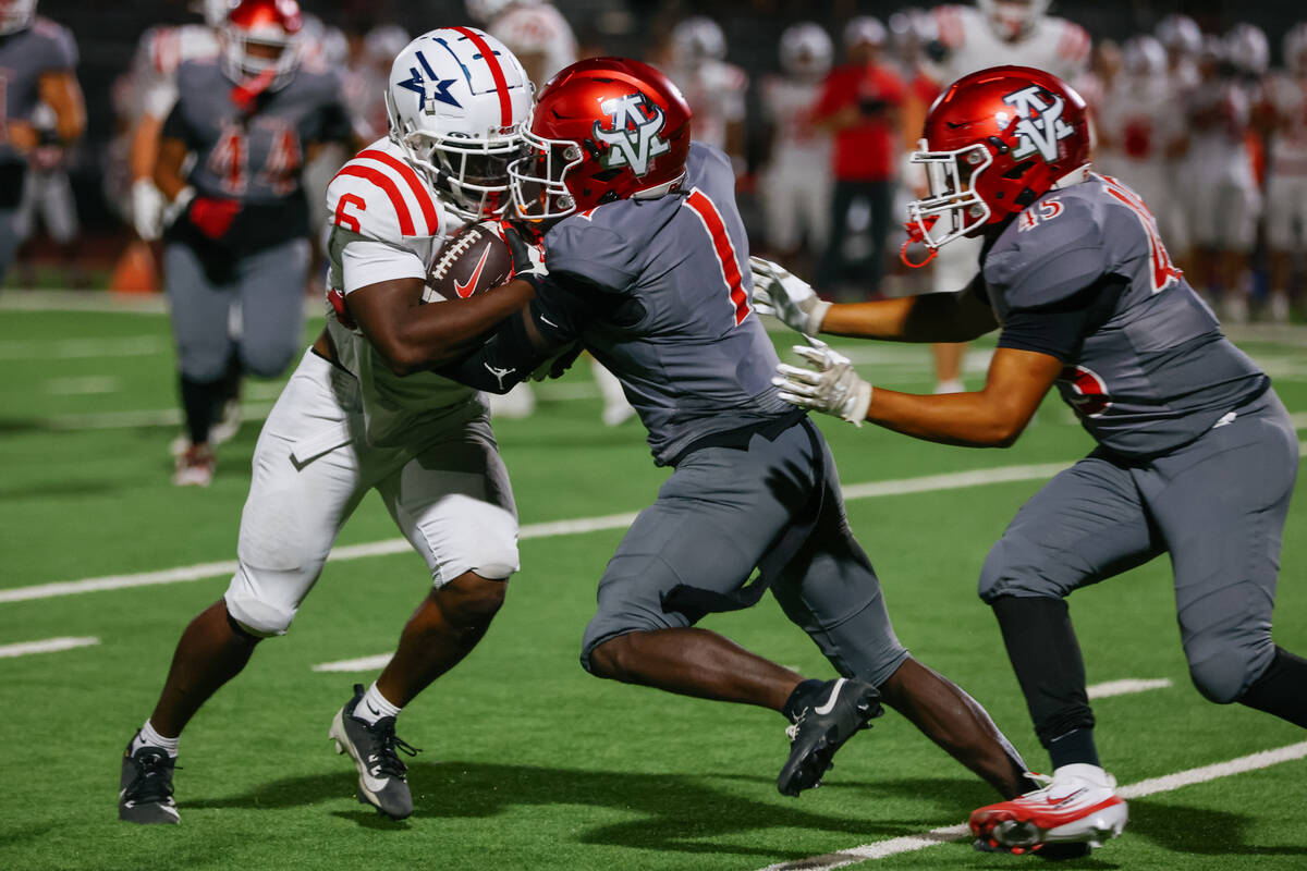 Arbor View cornerback Teddy Johnson (1) tackles Millard South running back Teagan Urban (6) dur ...