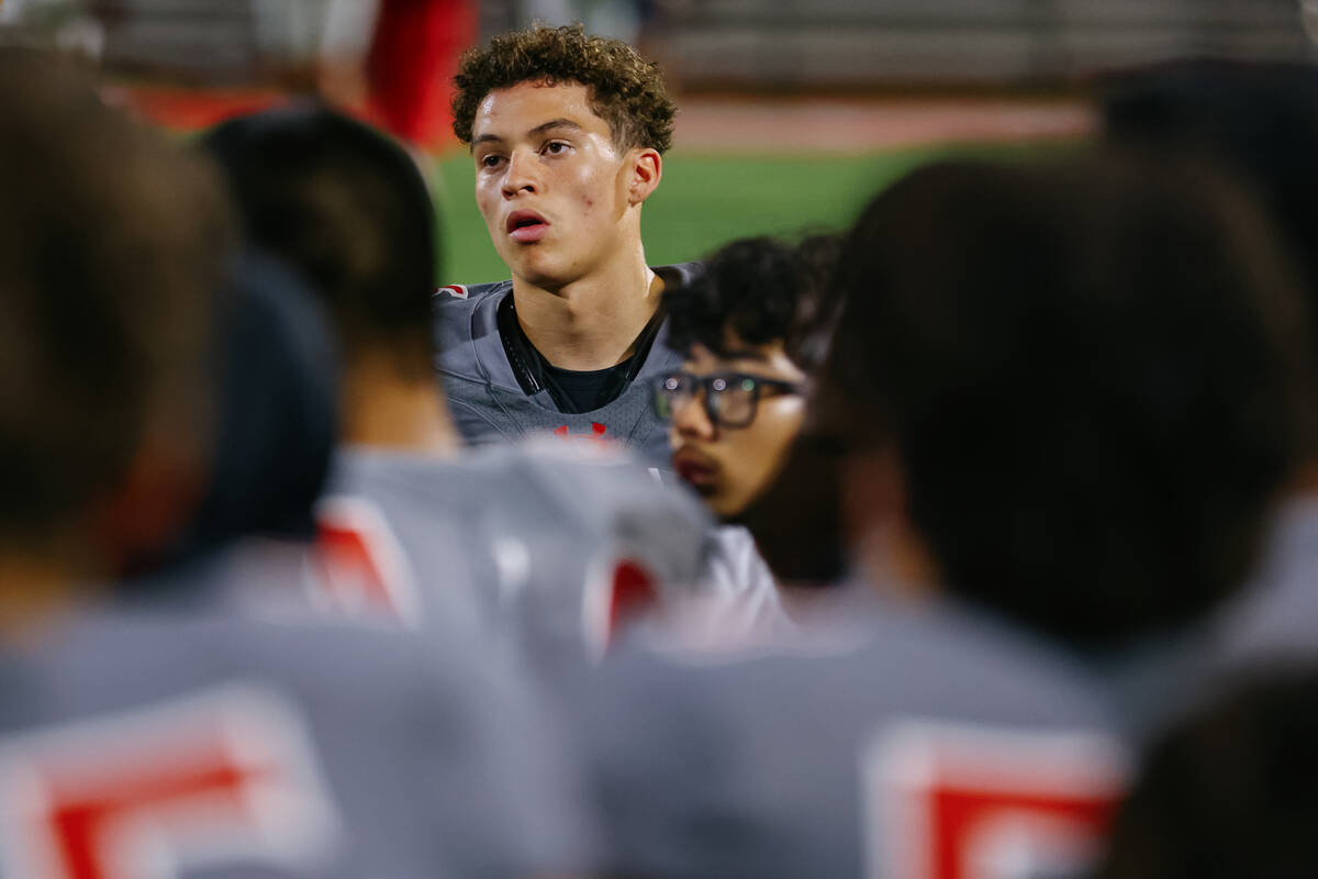 Arbor View wide receiver Jayden Williams (6) listens to head coach Sam Norris speak to the team ...