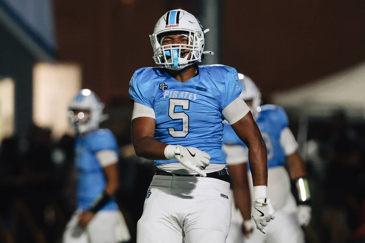 Sloan Canyon linebacker Kalepo Mose celebrates during a high school football game between Sloan ...