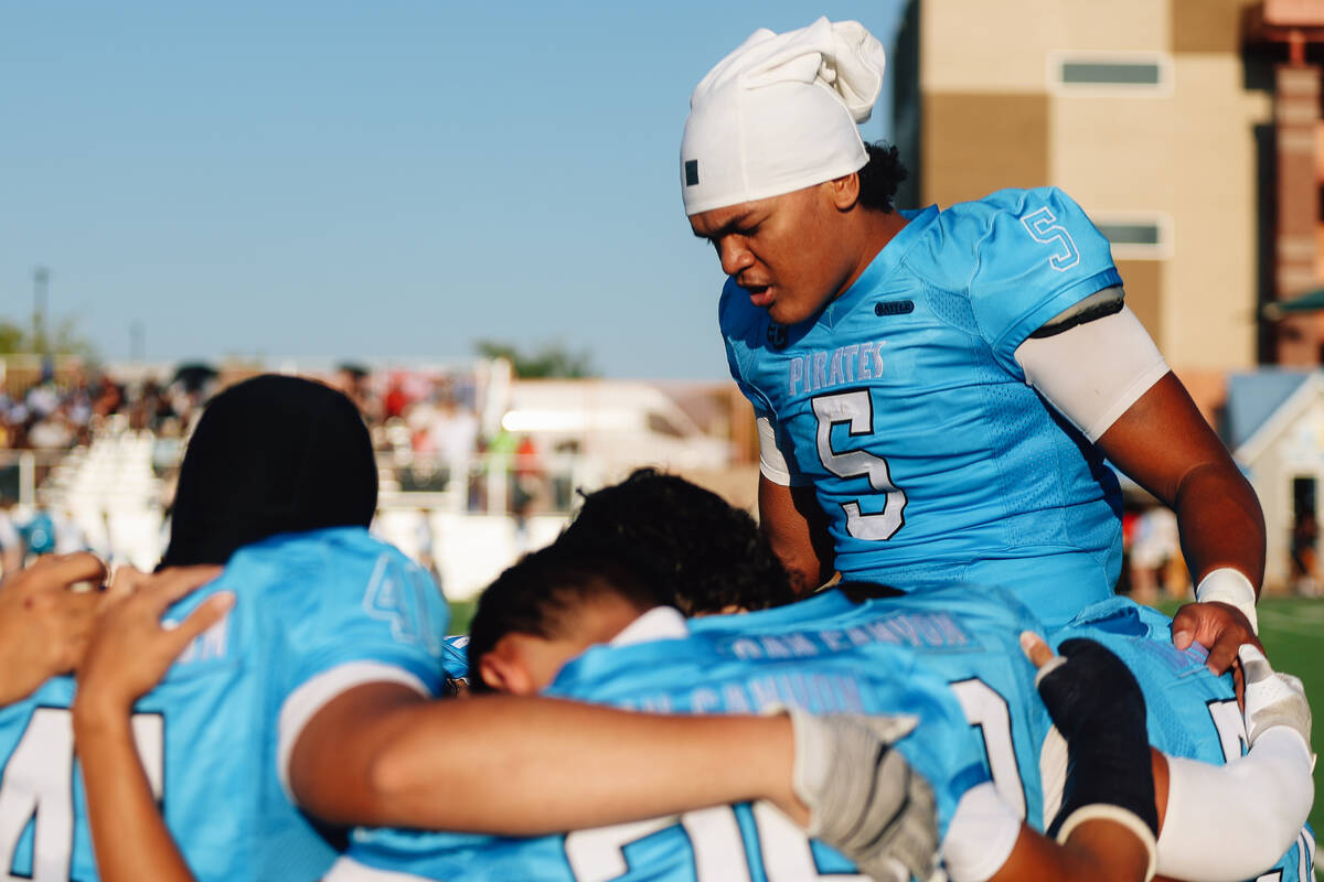 Sloan Canyon teammates pray during a high school football game between Sloan Canyon and Foothil ...