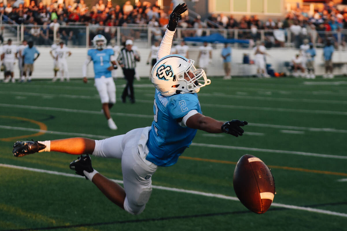 Sloan Canyon wide receiver Brandon Quaglio misses a catch during a high school football game be ...