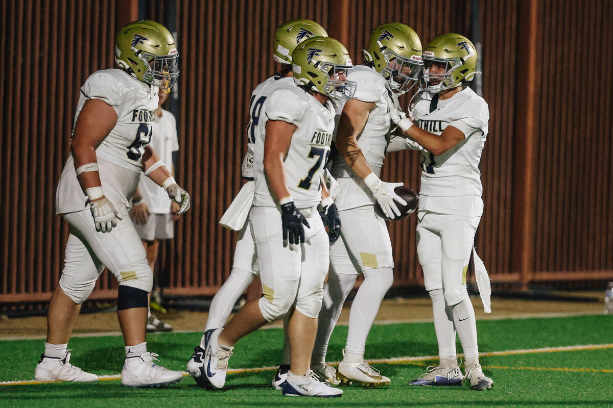 Foothill teammates celebrate a touchdown during a high school football game between Sloan Canyo ...