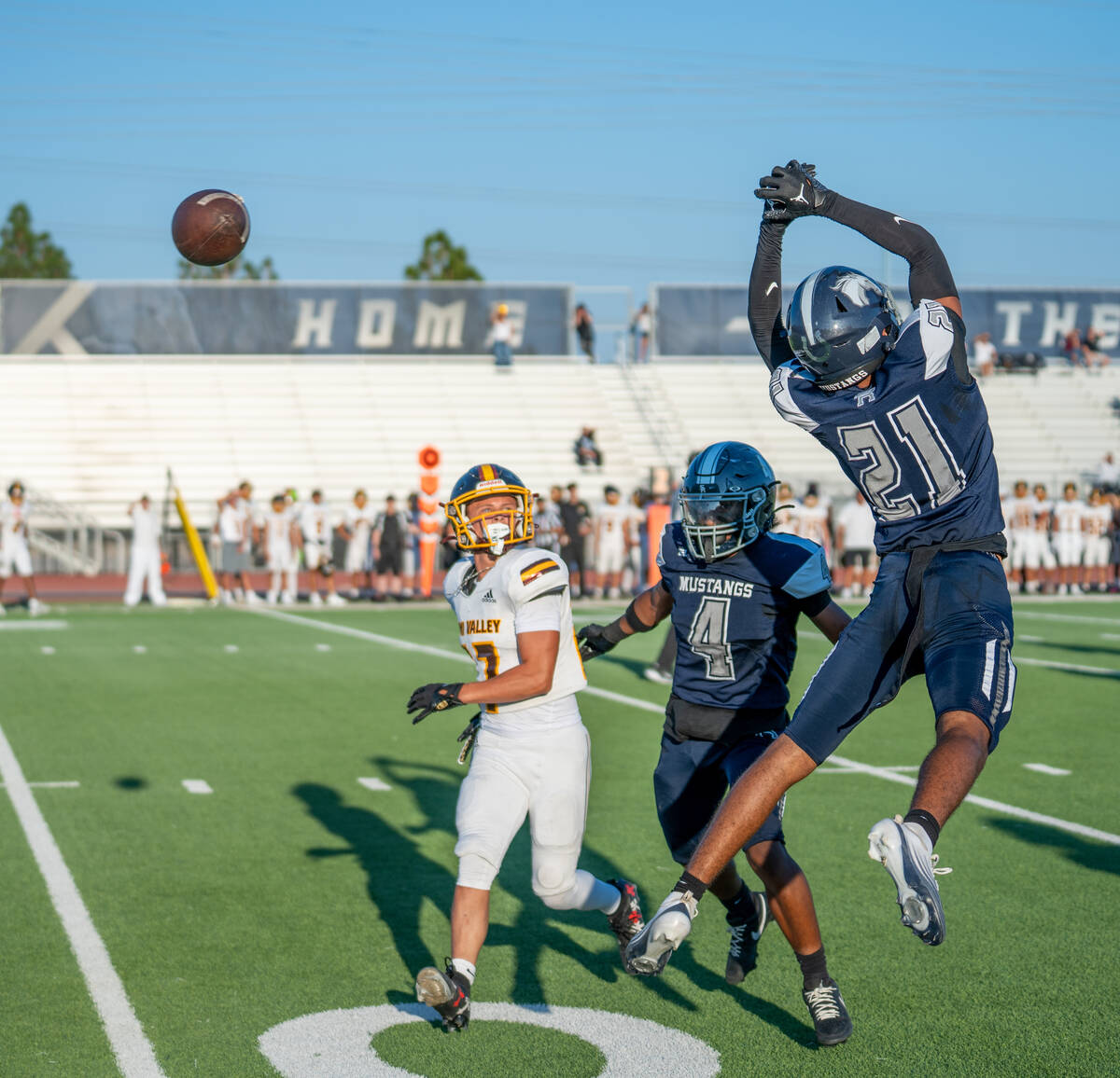 Shadow Ridge player Charles Parker (21) leaps to try and make an interception during a football ...