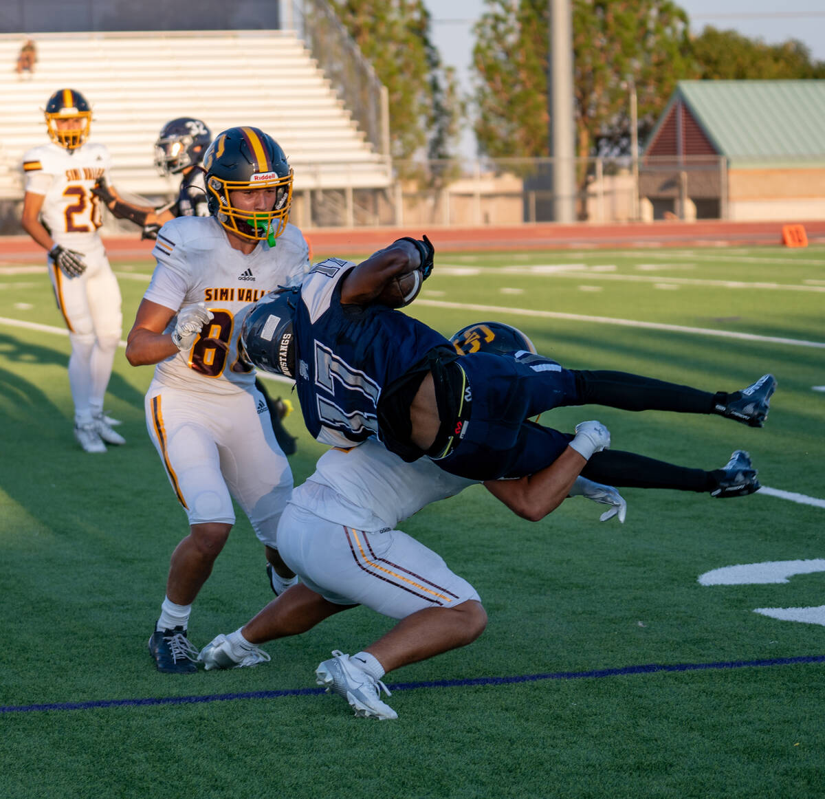 Shadow Ridge player Jokai Johnson (17) is taken down during a football game between Shadow Ridg ...