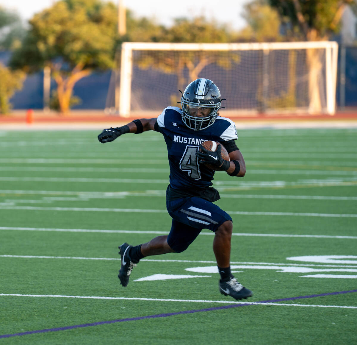 Shadow Ridge player Xavion Cross (4) finds an opening during a football game between Shadow Rid ...