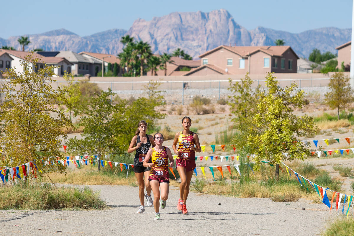 Runners from Clark and Pahrump Valley High School during the Junior/Senior Girls portion of th ...