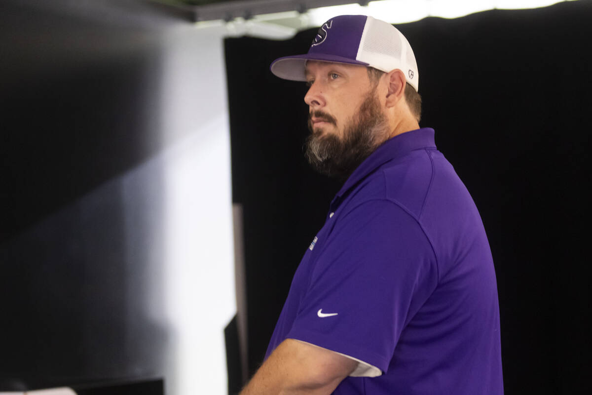 Silverado football head coach Anthony Barilla poses for a photo during a preseason meeting and ...