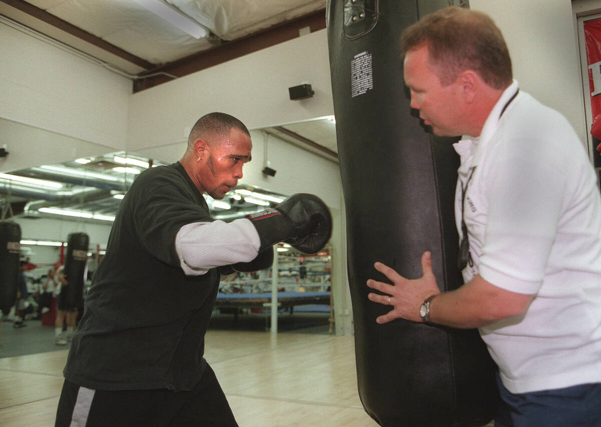 News Boxer Ishe Smith works out on the heavy bag as Pat Barry coaches him on Monday Sept 28 199 ...