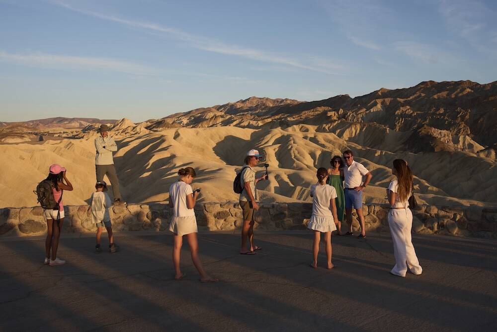 Tourists visit Zabriskie Point, Sunday, Aug. 3, 2025, in Death Valley National Park, Calif. (AP ...