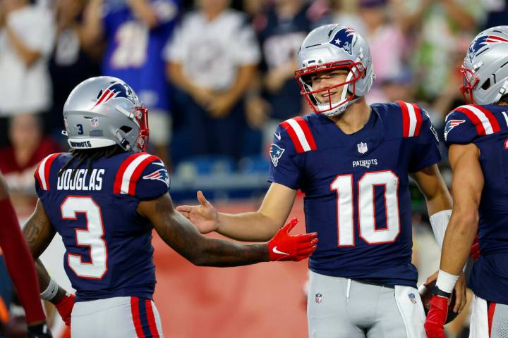 New England Patriots quarterback Drake Maye (10) celebrates with wide receiver DeMario Douglas ...