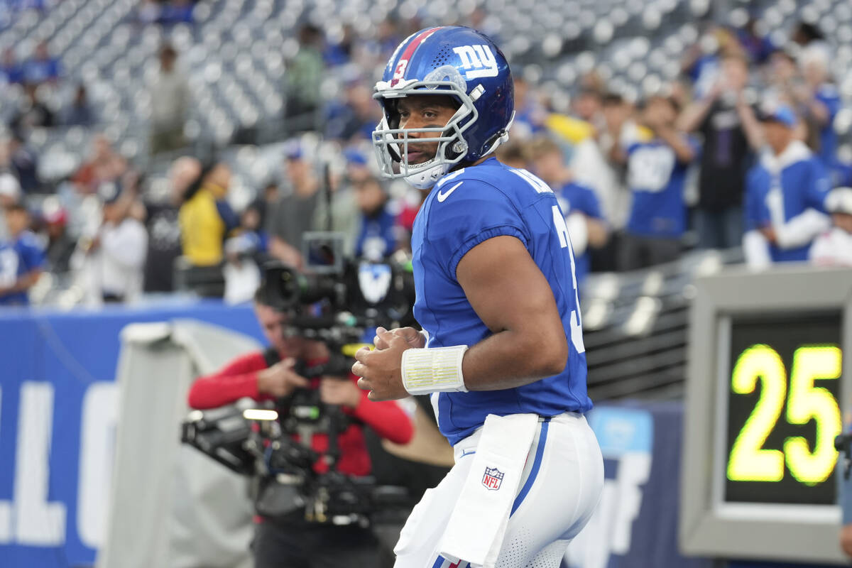 New York Giants quarterback Russell Wilson (3) warms up before an NFL preseason football game a ...