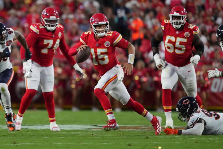 Kansas City Chiefs quarterback Patrick Mahomes (15) looks to pass during an NFL preseason footb ...