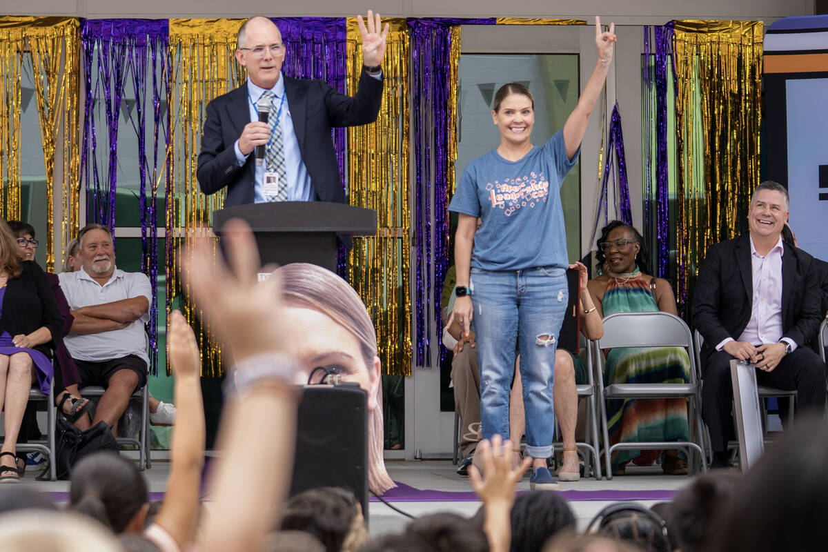 Ali Jun quiets the applause with Steve Canavero, Ph.D., Nevada’s interim superintendent ...