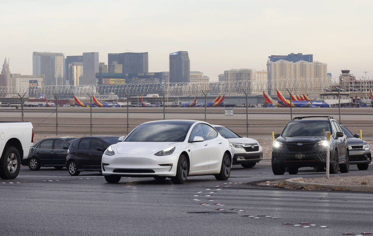 Motorists navigate on Sunset Road after exiting from the Airport Connector Interchange off-ramp ...