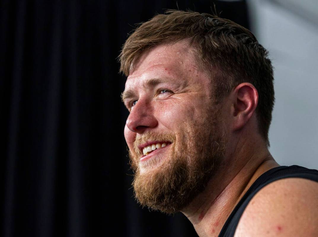 Raiders offensive tackle Kolton Miller (74) answers a question during an interview at training ...