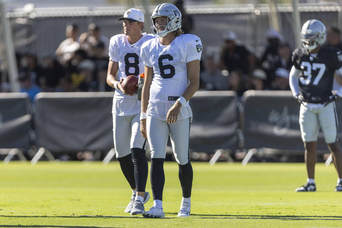 Raiders punter AJ Cole (6) and place kicker Daniel Carlson (8) have a discussion on the field d ...