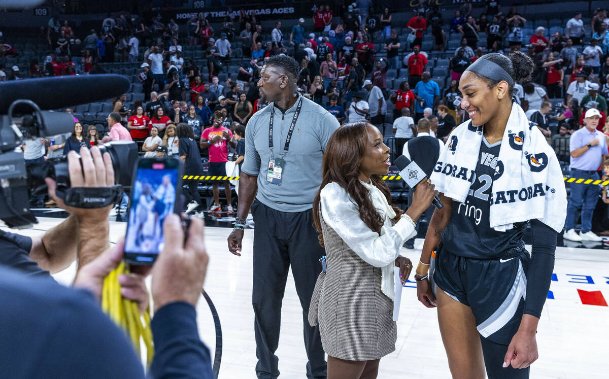 Las Vegas Aces security director Sonny Watson keeps a watch on the crowd as Aces center A'ja Wi ...