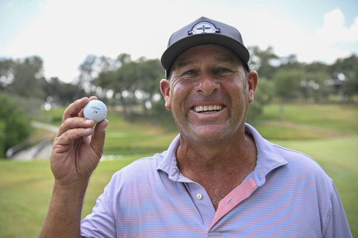 Joe Sawaia shows off the Titleist he used to ace the par-3, 136-yard 13th hole during the secon ...