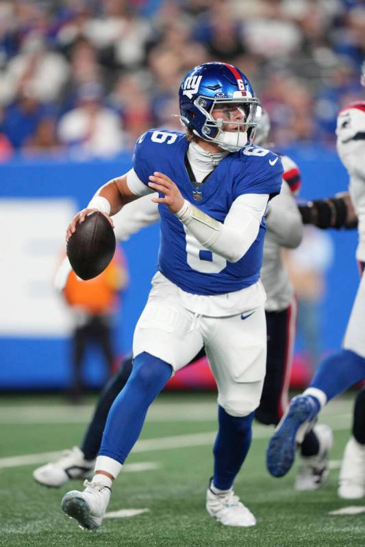 New York Giants quarterback Jaxson Dart (6) scrambles during an NFL preseason football game aga ...