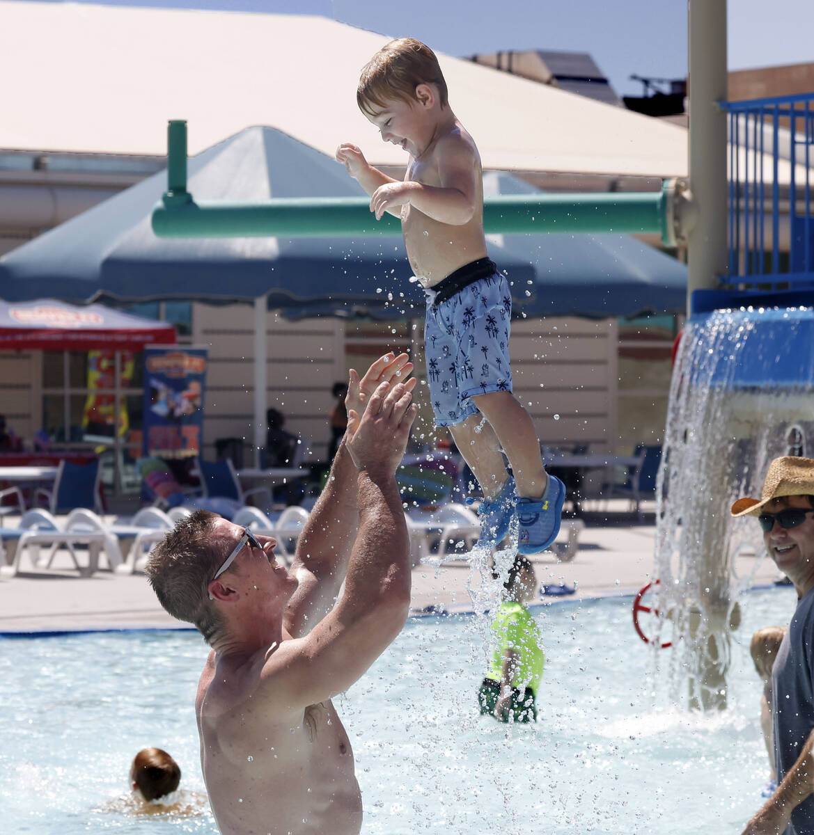 Tyler Philip plays with his 5-year-old son Maddox at Whitney Ranch Pool during Labor Day pool p ...
