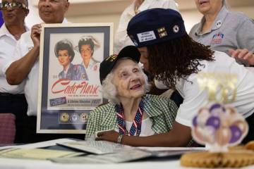 Members of the Women’s Veteran’s of Nevada speak with Henderson resident Lorraine ...