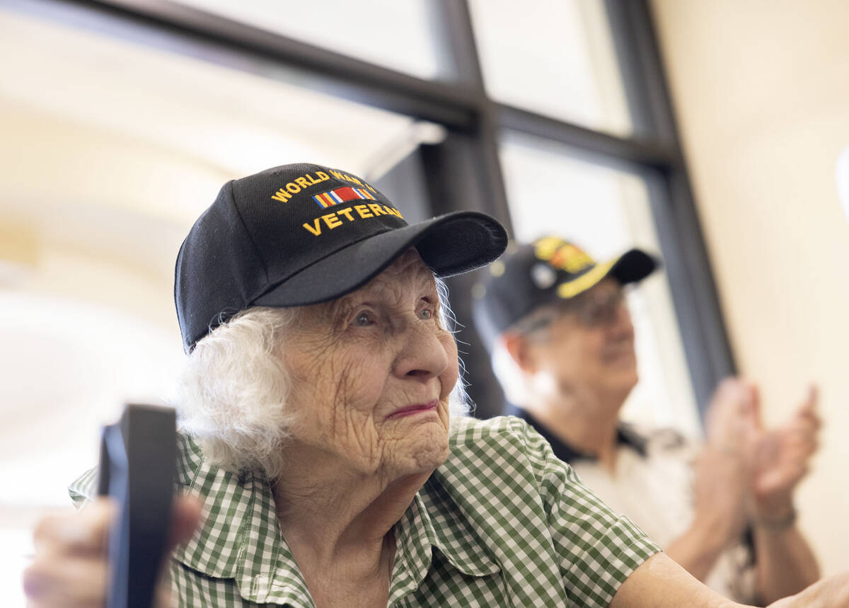 Henderson resident Lorraine Demarest stands during the pledge of allegiance during her 100th bi ...