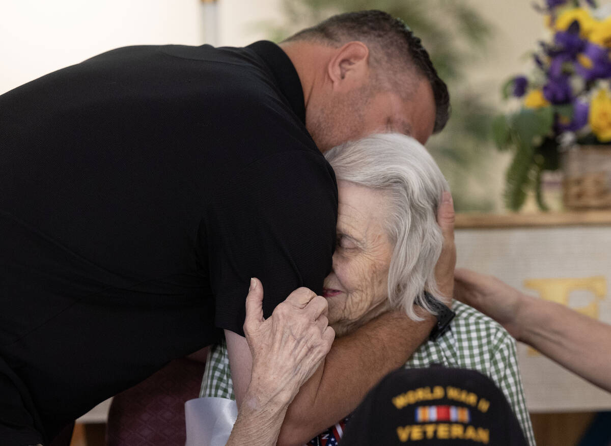 David Demarest hugs his grandmother Lorraine during her 100th birthday celebration at Christ th ...