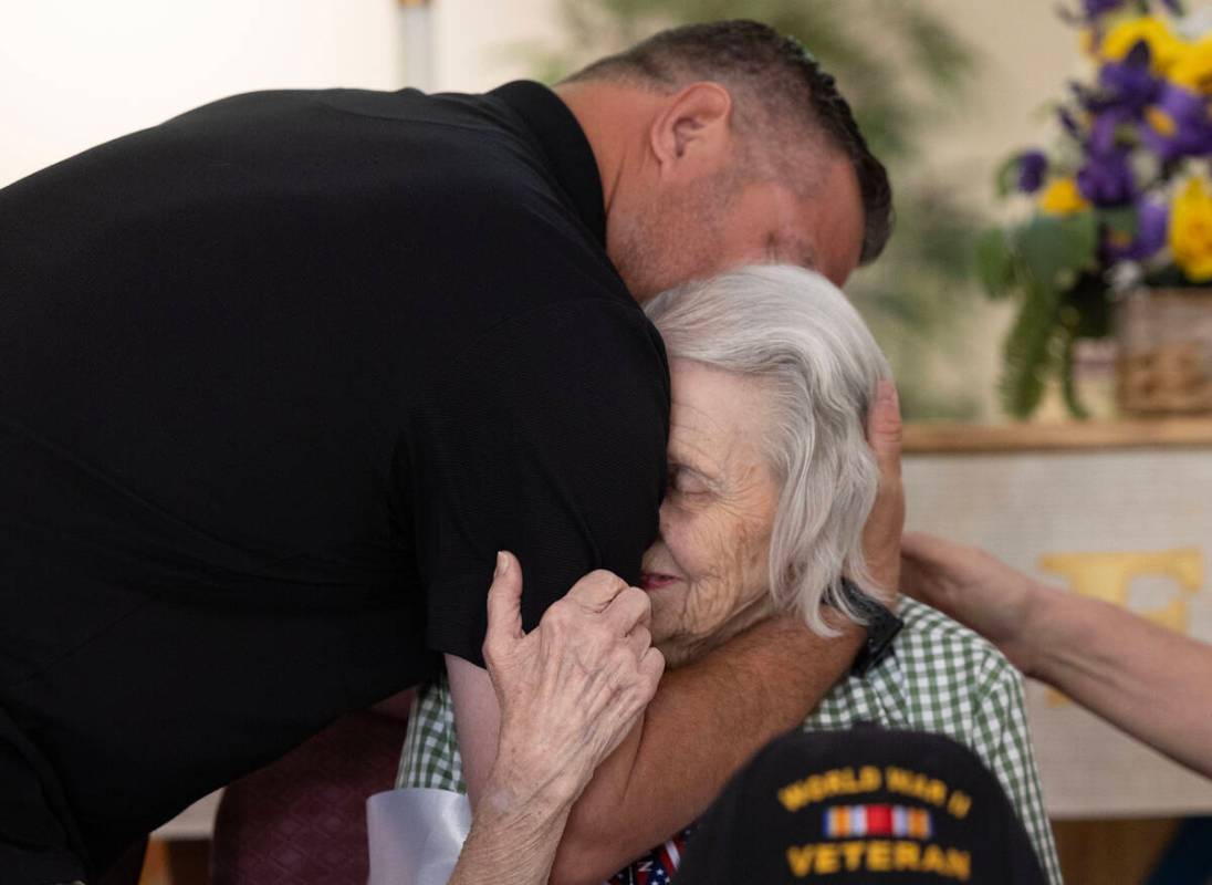 David Demarest hugs his grandmother Lorraine during her 100th birthday celebration at Christ th ...