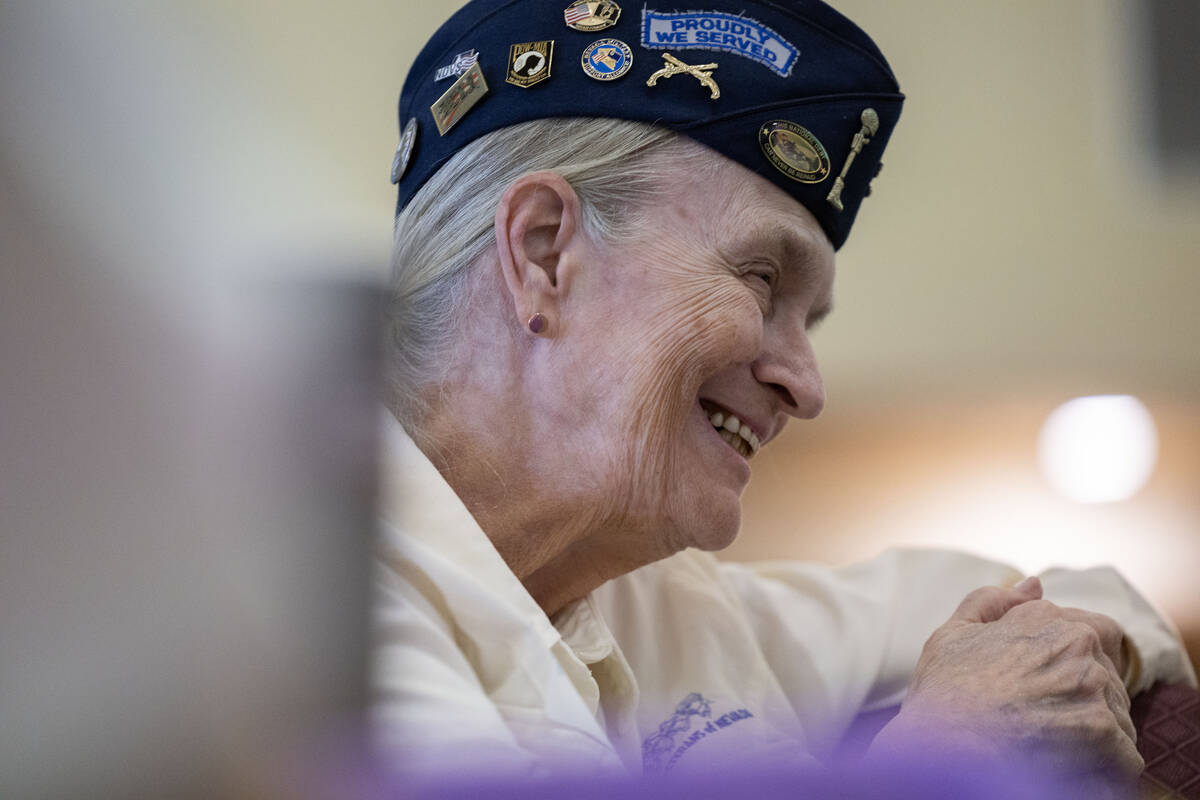 Sgt. Dixie Thompson with the Women’s Veteran’s of Nevada reacts to a speaker during Henders ...