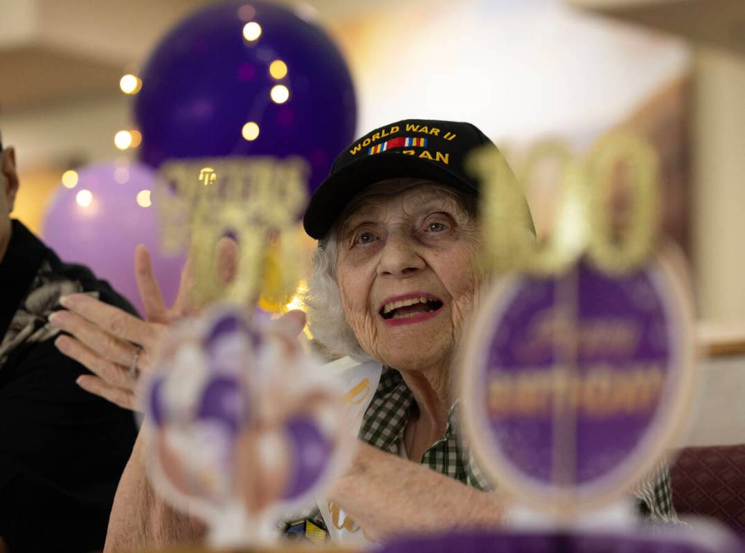 Henderson resident Lorraine Demarest reacts to a speaker during her 100th birthday celebration ...