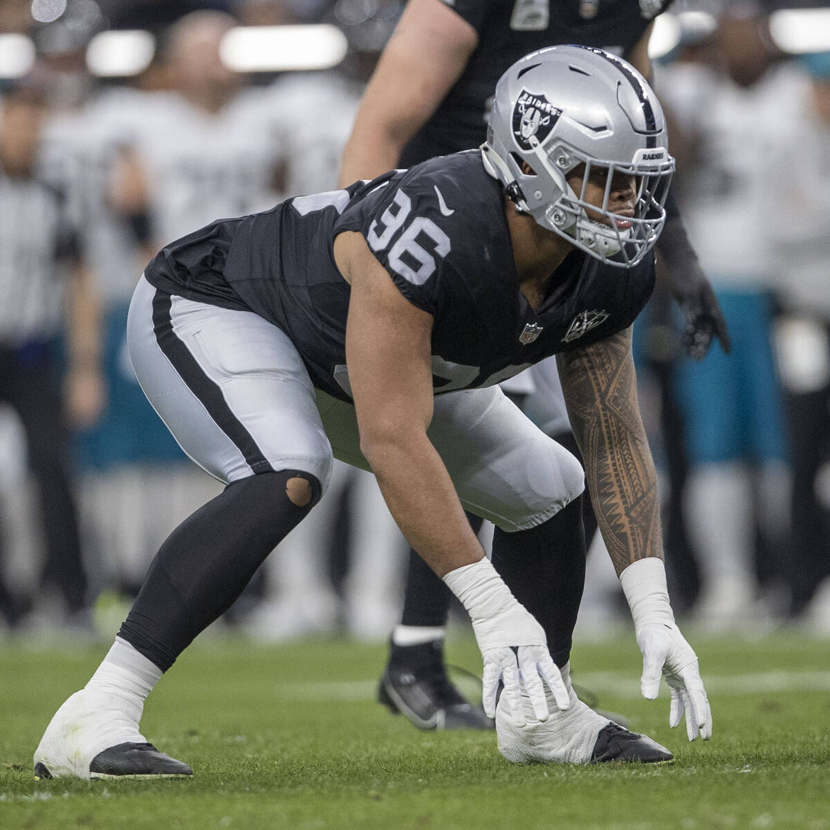 Raiders defensive tackle Jonah Laulu (96) gets set on the line of scrimmage during the first ha ...