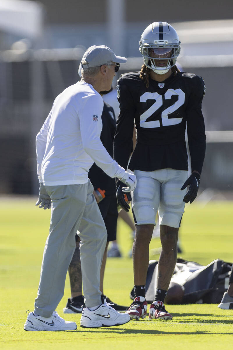 Raiders head coach Pete Carroll walks past cornerback Eric Stokes (22) during the team’s ...