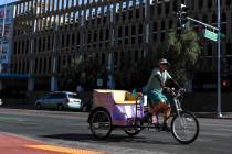 A pedicab rides along 3rd Street near the Downtown Grand hotel-casino in Las Vegas on Tuesday, ...