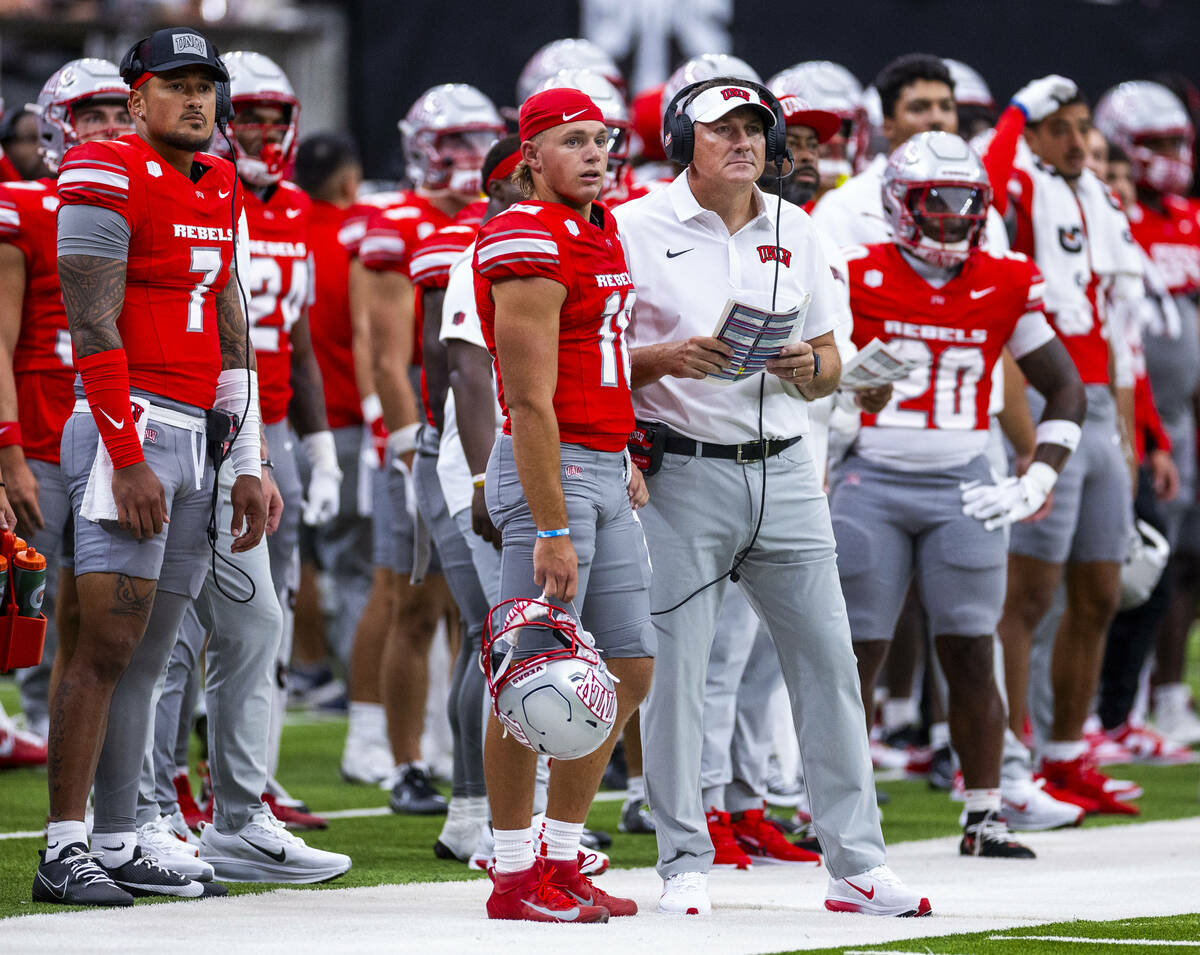 UNLV quarterback Cameron Friel (7), quarterback Anthony Colandrea (10) and head coach Dan Mulle ...