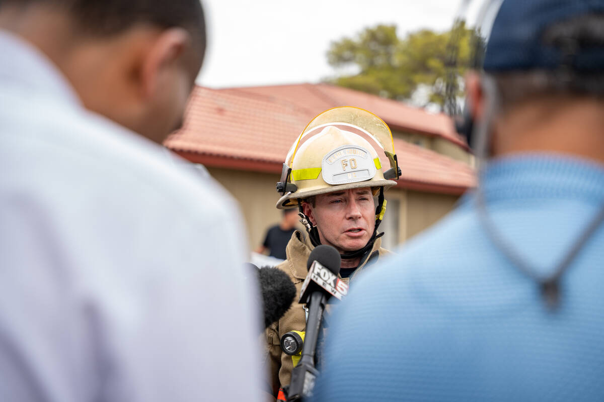 Deputy Fire Chief Kenny Holding updates the public about a fire that had just been extinguished ...