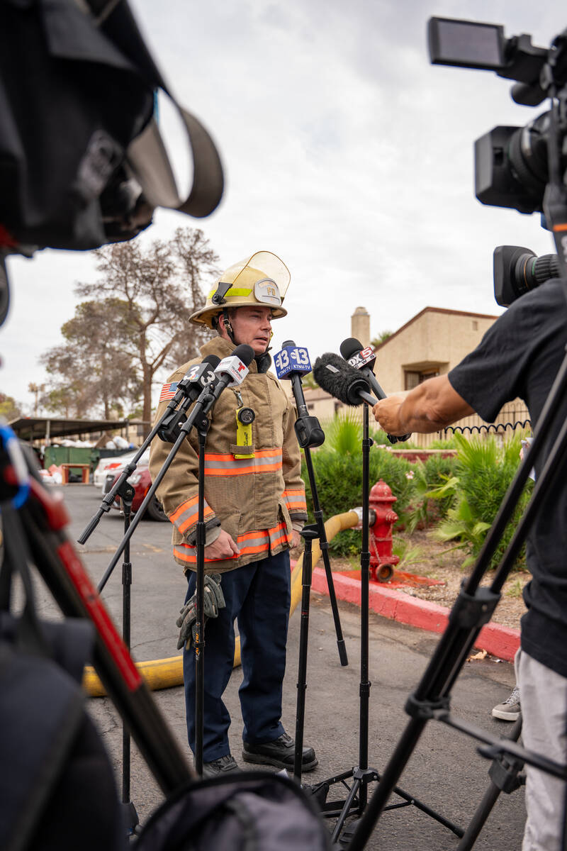Deputy Fire Chief Kenny Holding updates the public about a fire that had just been extinguished ...