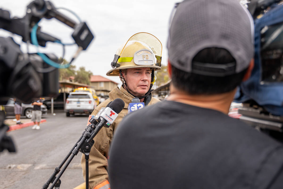 Deputy Fire Chief Kenny Holding updates the public about a fire that had just been extinguished ...