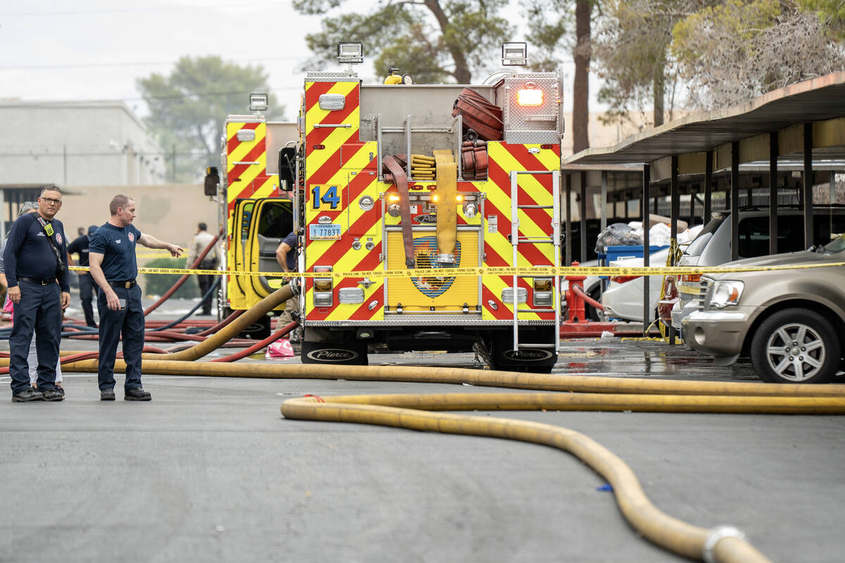Firefighters depart after extinguishing a fire in a Las Vegas apartment complex Sept. 2, 2025. ...