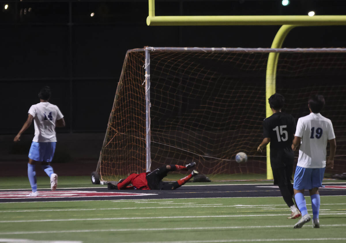 Canyon Springs goalkeeper Enrique Vargas tries to stop a shot from Las Vegas during a soccer ga ...
