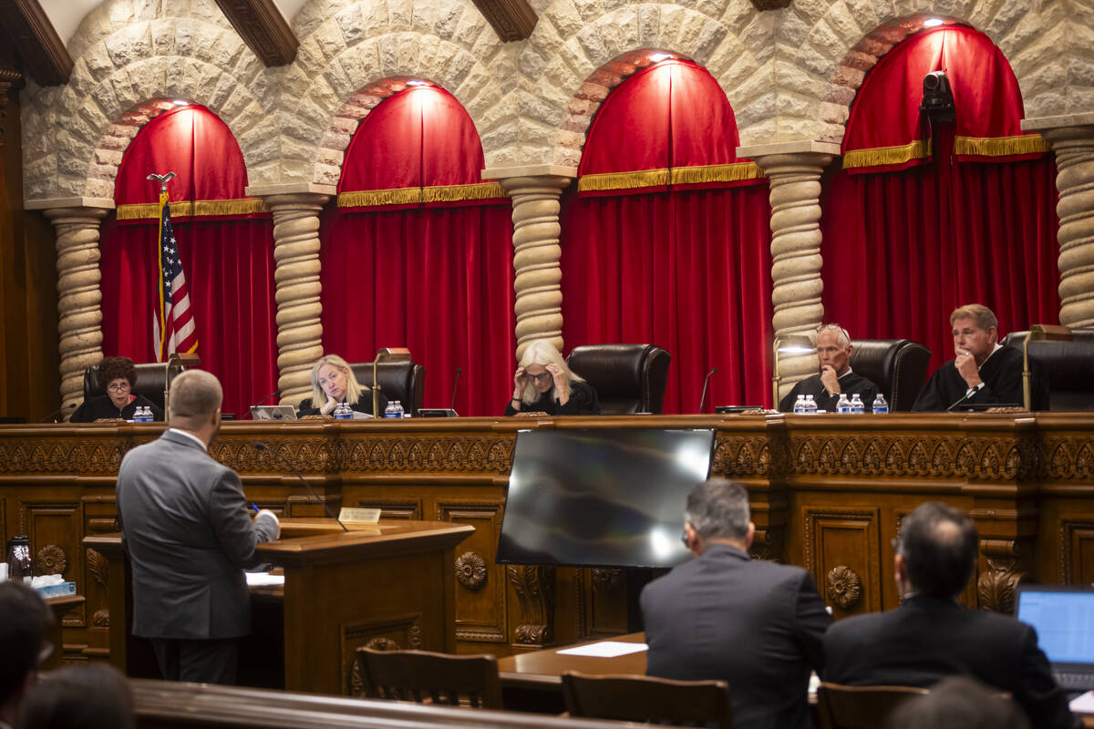 The Nevada Supreme Court justices listen to of J. Gregory Cloward, left, representing Nevada st ...