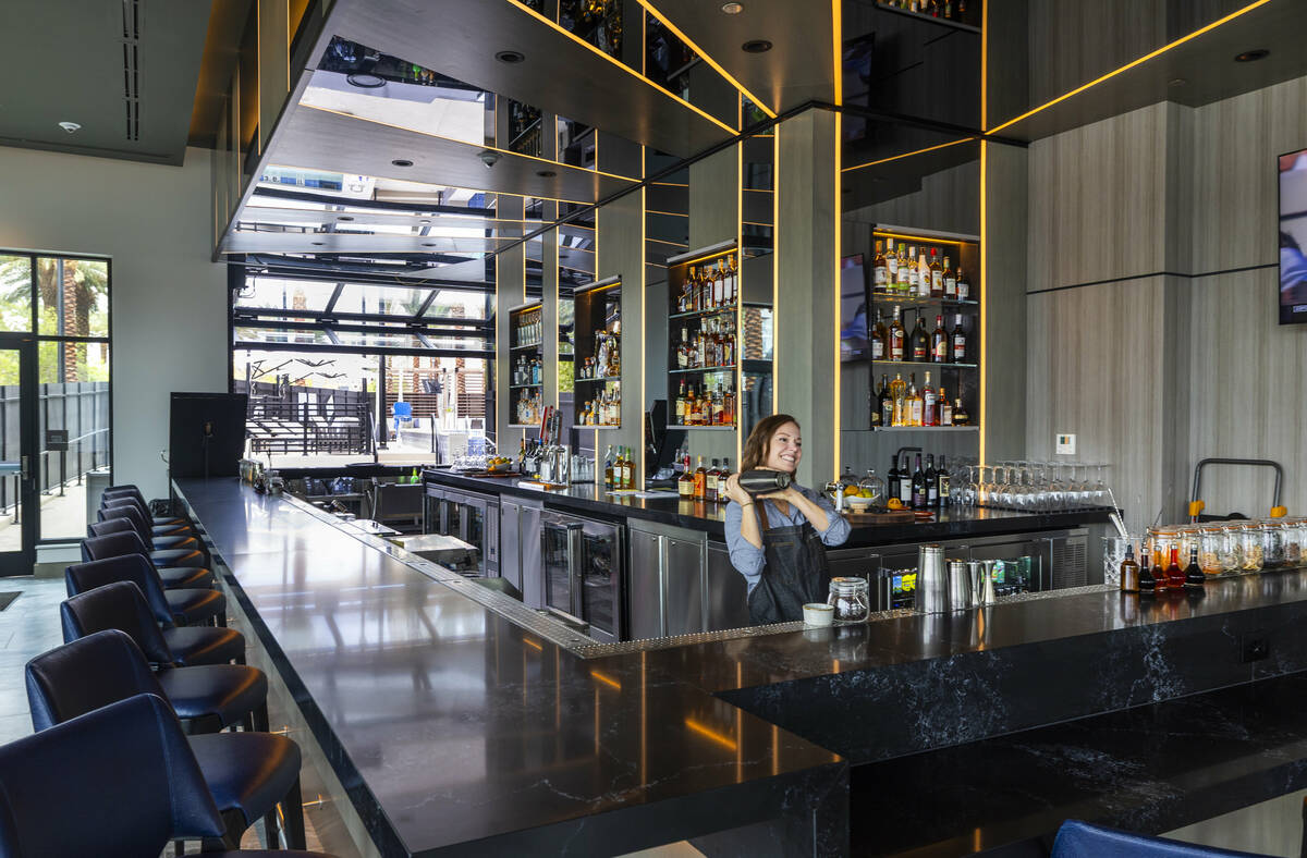 Bartender Tawny Shoemaker shakes a drink in the Element bar within the new AC / Element Hotel S ...