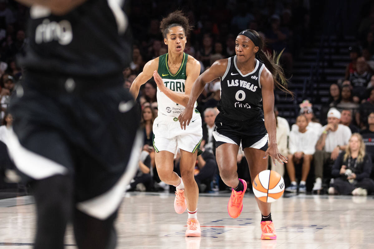Las Vegas Aces guard Jackie Young (0) moves the ball towards the basket during a WNBA basketbal ...