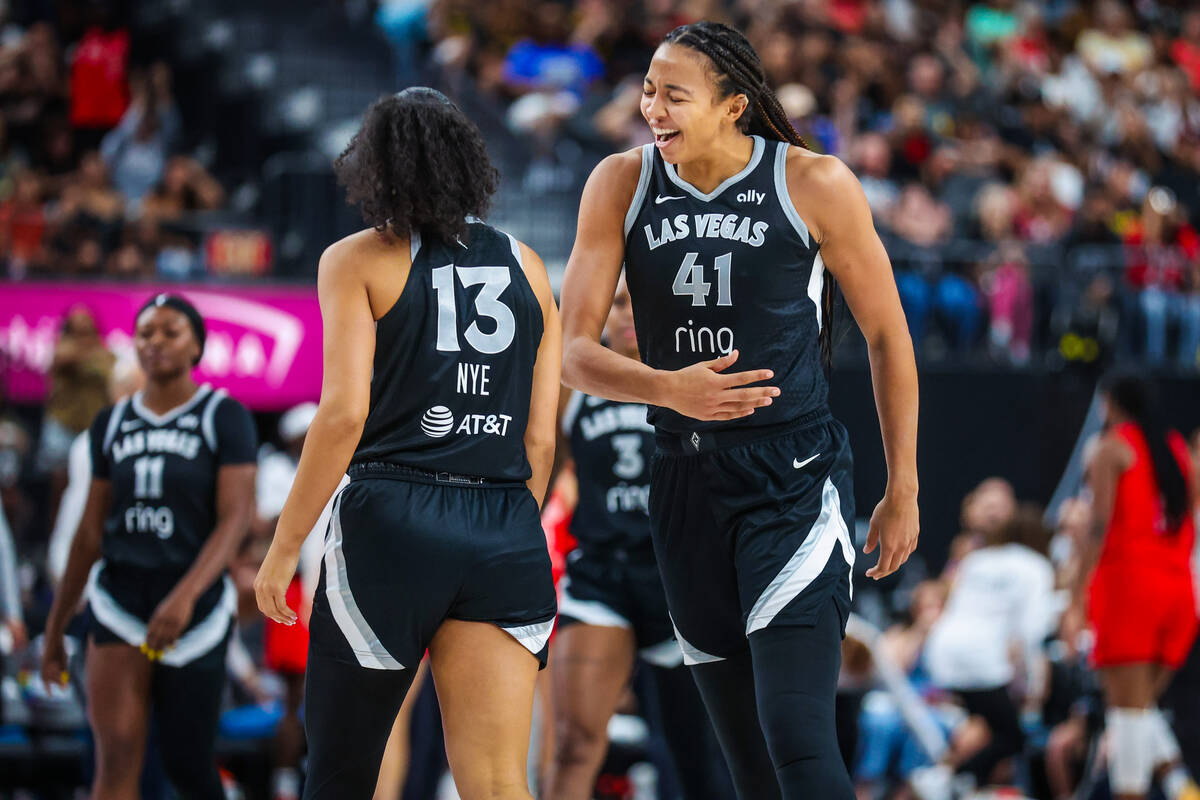 Aces center Kiah Stokes (41) celebrates Aces guard Aaliyah Nye (13) during a WNBA basketball ga ...