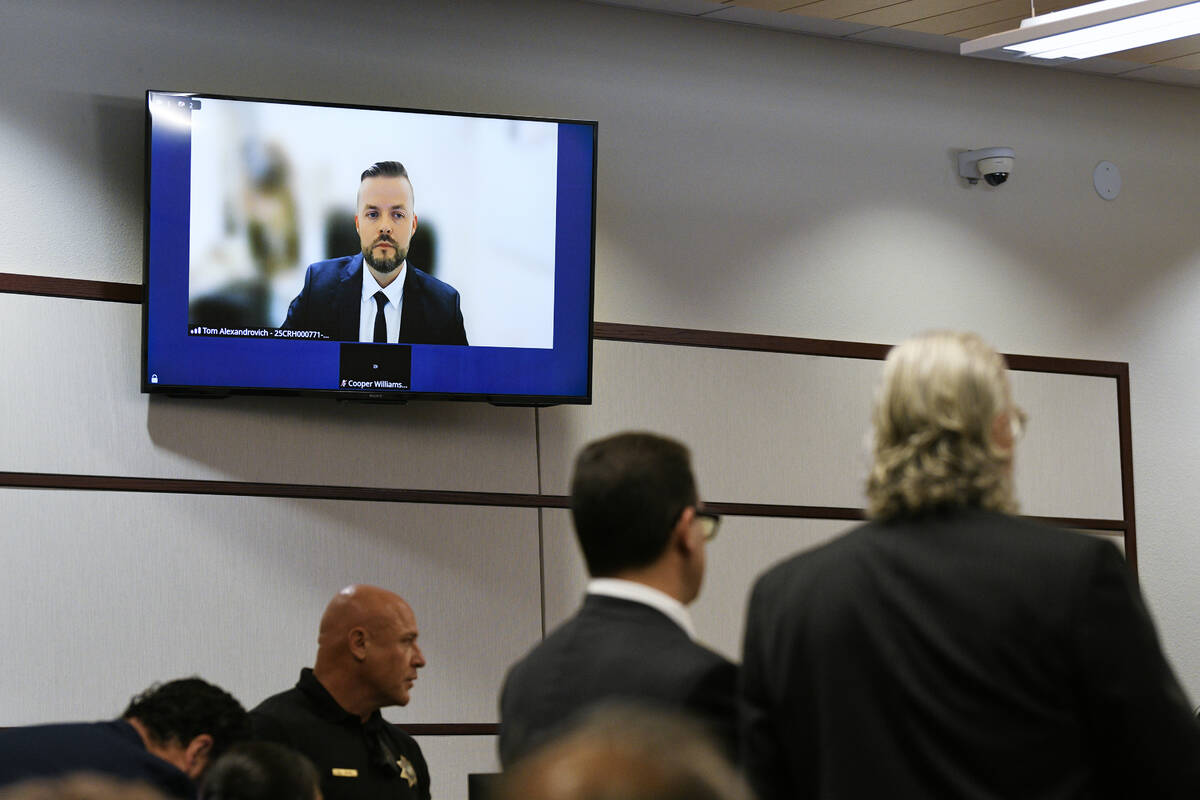 Israeli official Tom Artiom Alexandrovich appears remotely for a hearing on charges of trying t ...