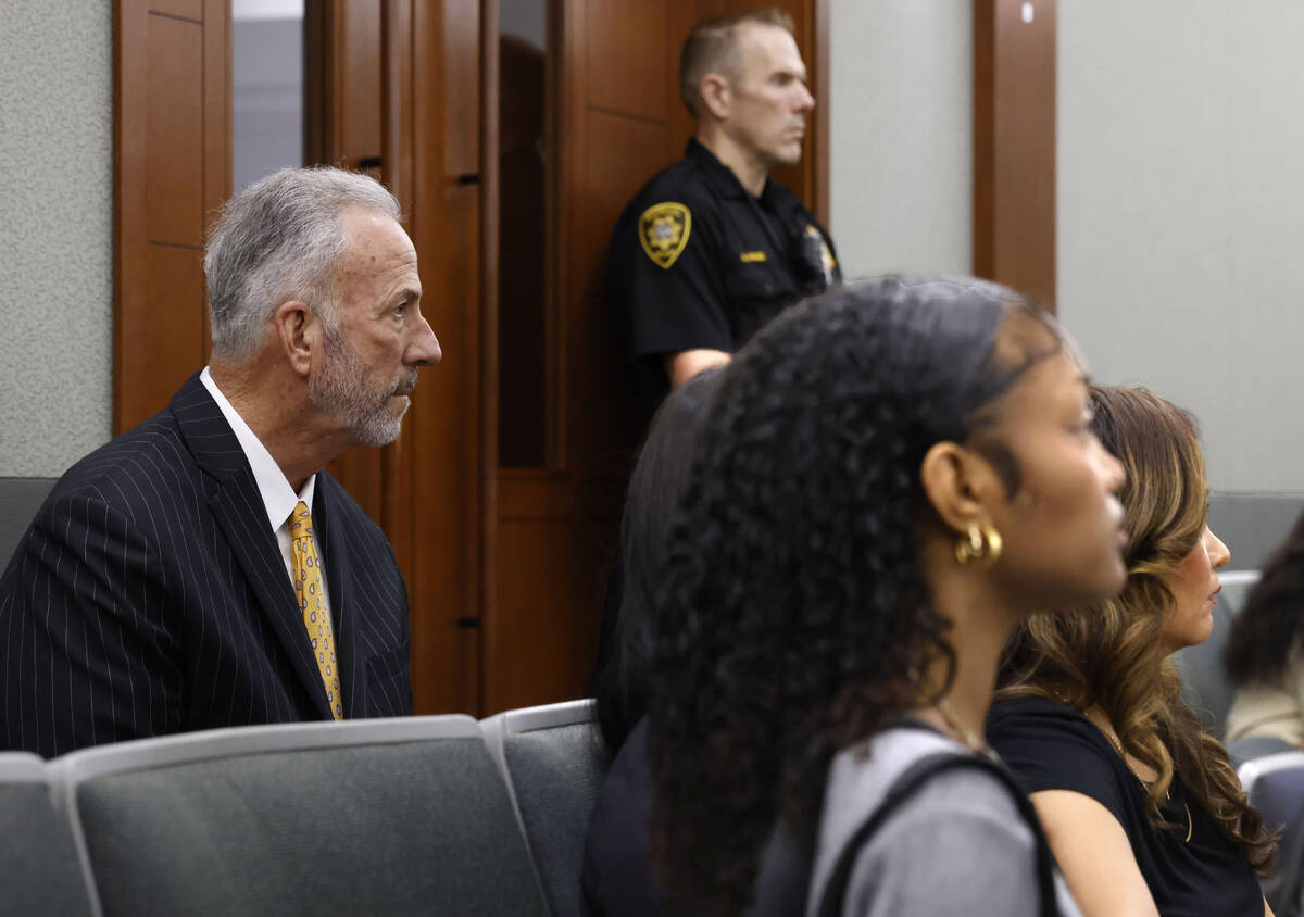 Clark County District Attorney Steve Wolfson, left, and Aracely Palacio, the mother of murder v ...